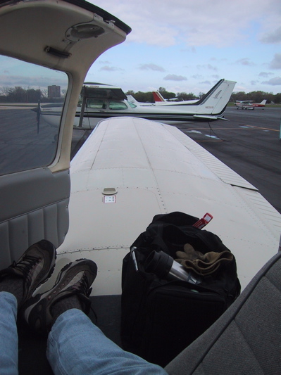 My feet and the wing of a PA-28-181